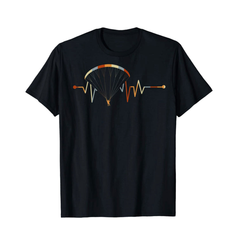 Paragliding T-Shirt Herzlinie mit Grafik eines Mannes, der einen Gleitschirm hält, ideal für Gleitschirmflieger und Fans von Paragliding24.ch.
