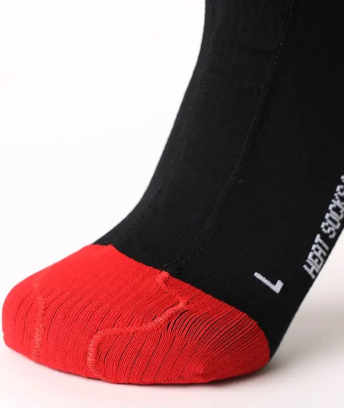 Lenz HEAT SOCK 6.1 Toe Cap Merino Compression, schwarze Socke mit roter Sohle, integriertes Heizsystem für Zehenwärme, ideal für anspruchsvolle Outdoor-Aktivitäten.