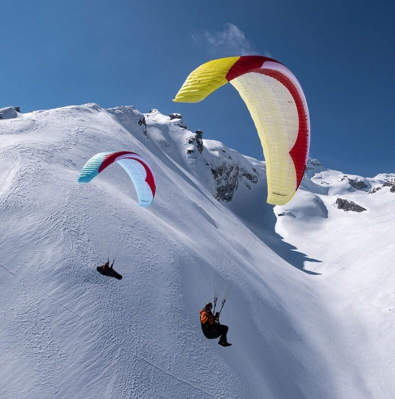 GIN Explorer 2 Gleitschirm bei Schneeflug. Hochwertiger High EN-B Leichtschirm, ideal für abenteuerliches Paragliding. Perfekte Gleitleistung und Stabilität für unbeschwerten Flugspaß.