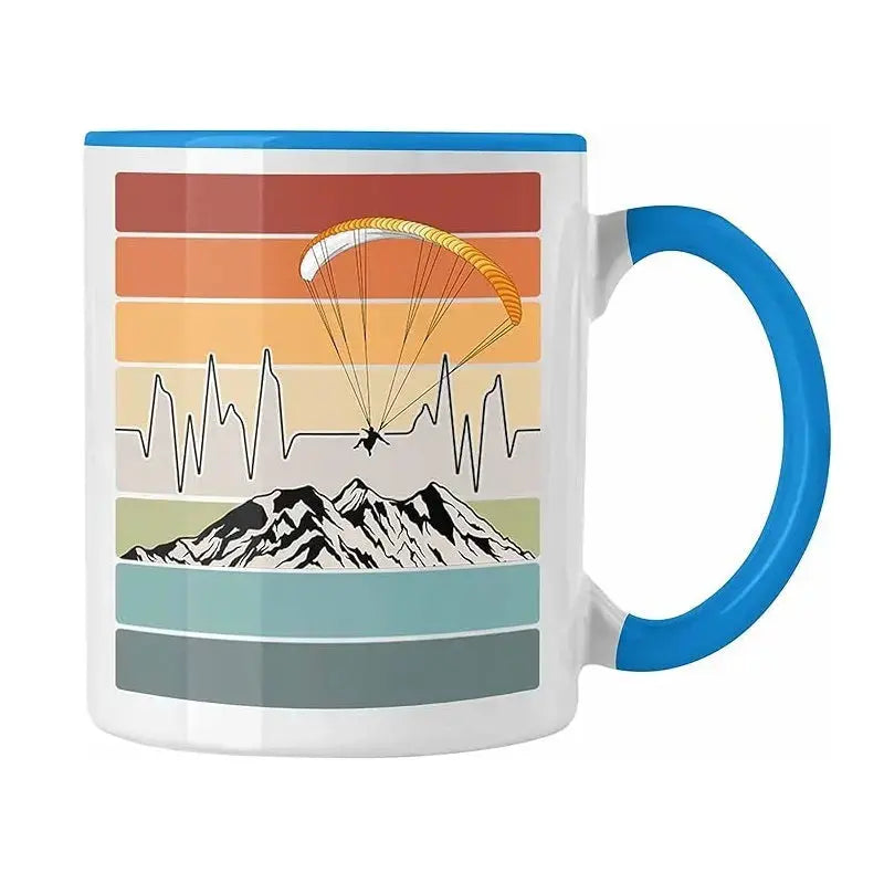 Gleitschirm Kaffee Tasse Rainbow mit Berg- und Gleitschirmmotiv, ideal für Paragliding-Fans. Keramik, 330ml, spülmaschinen- und mikrowellenfest, beidseitig bedruckt.