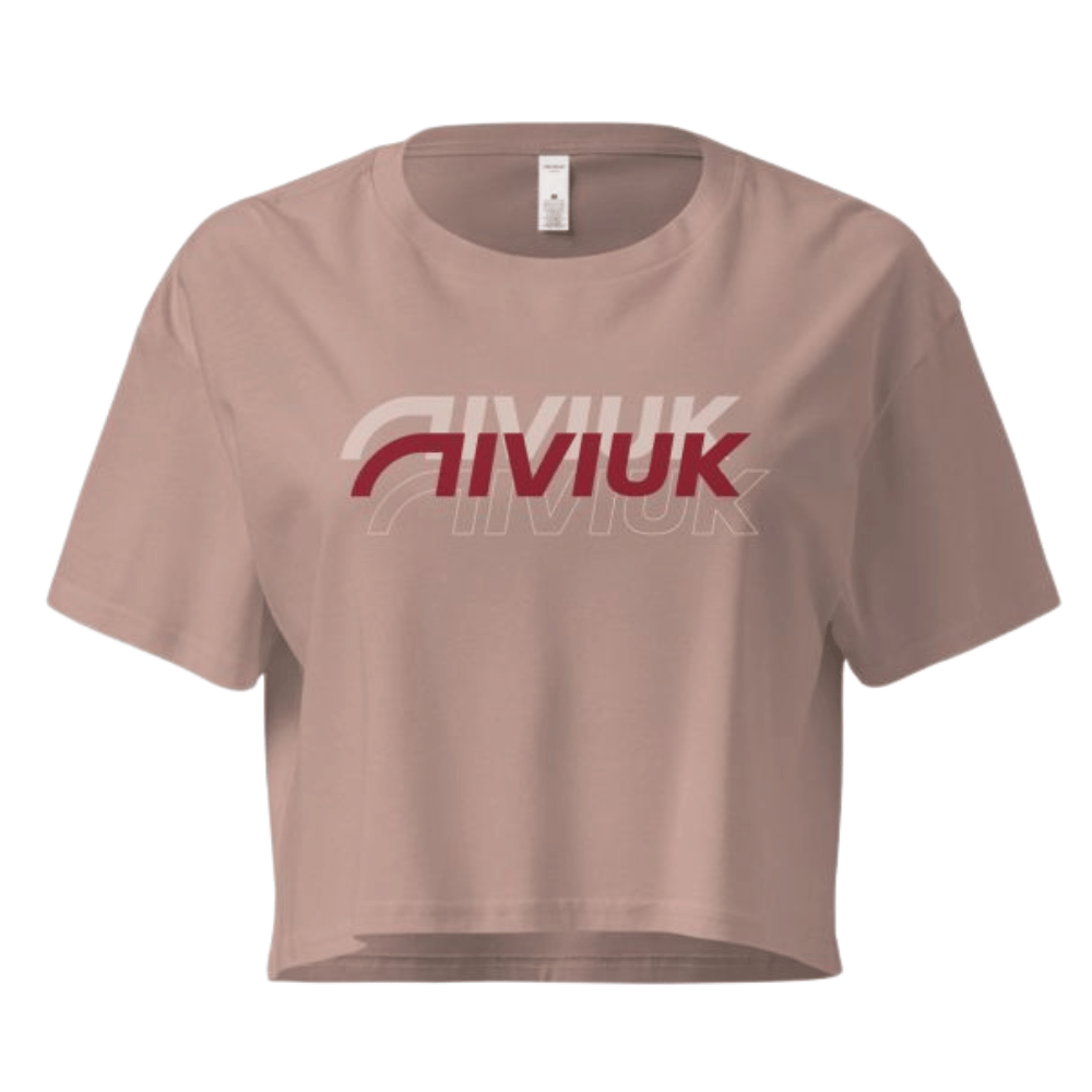 Niviuk X3 Croptop: Pinkes, kurzes T-Shirt mit weißem Niviuk-Logo, ideal für Paragliderinnen, aus nachhaltiger Baumwolle mit bequemem Schnitt.