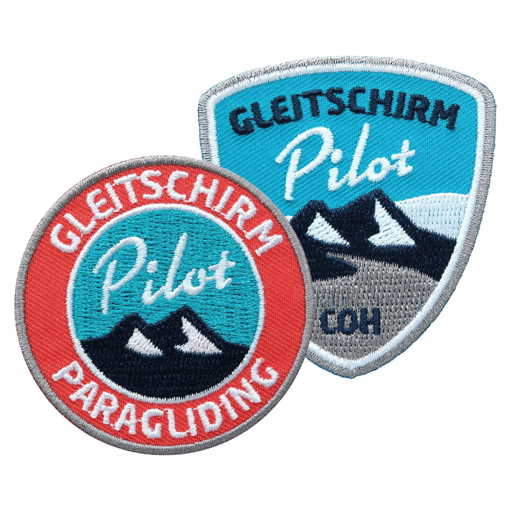 Paragliding Pilot Sticker zum Aufnähen oder Aufbügeln, zeigt ein hochwertiges Gleitschirm-Motiv, ideal für Jacken oder Rucksäcke von Paragliding-Enthusiasten.