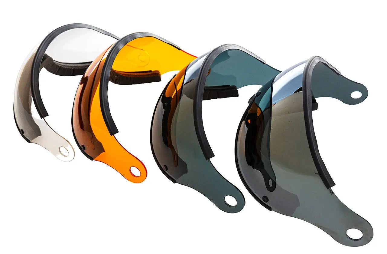 Fünf Ersatzvisiere für Icaro Eco / Nevo Helme in verschiedenen Farben: schwarz, blau verspiegelt, grau, orange und klar. Klare Sicht und Schutz.