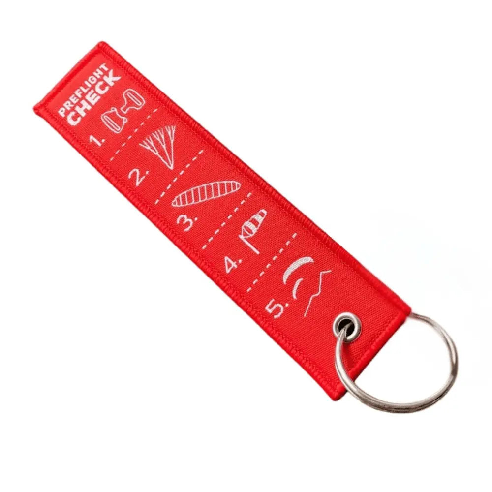 5-Punkte-Check Schlüsselanhänger mit grafischer Darstellung der 5 Start-checkpunkte auf der Vorderseite in rot mit weisser Schrift, hochwertig gewebt, ideal für Gleitschirmpiloten.