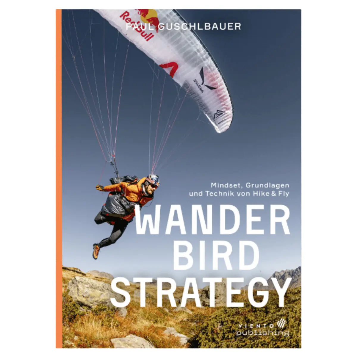 Buchcover von "Wanderbird Strategie von Paul Guschlbauer" mit einem Gleitschirmflieger in orangefarbener Kleidung beim Hike & Fly über felsigem Gelände und blauem Himmel.